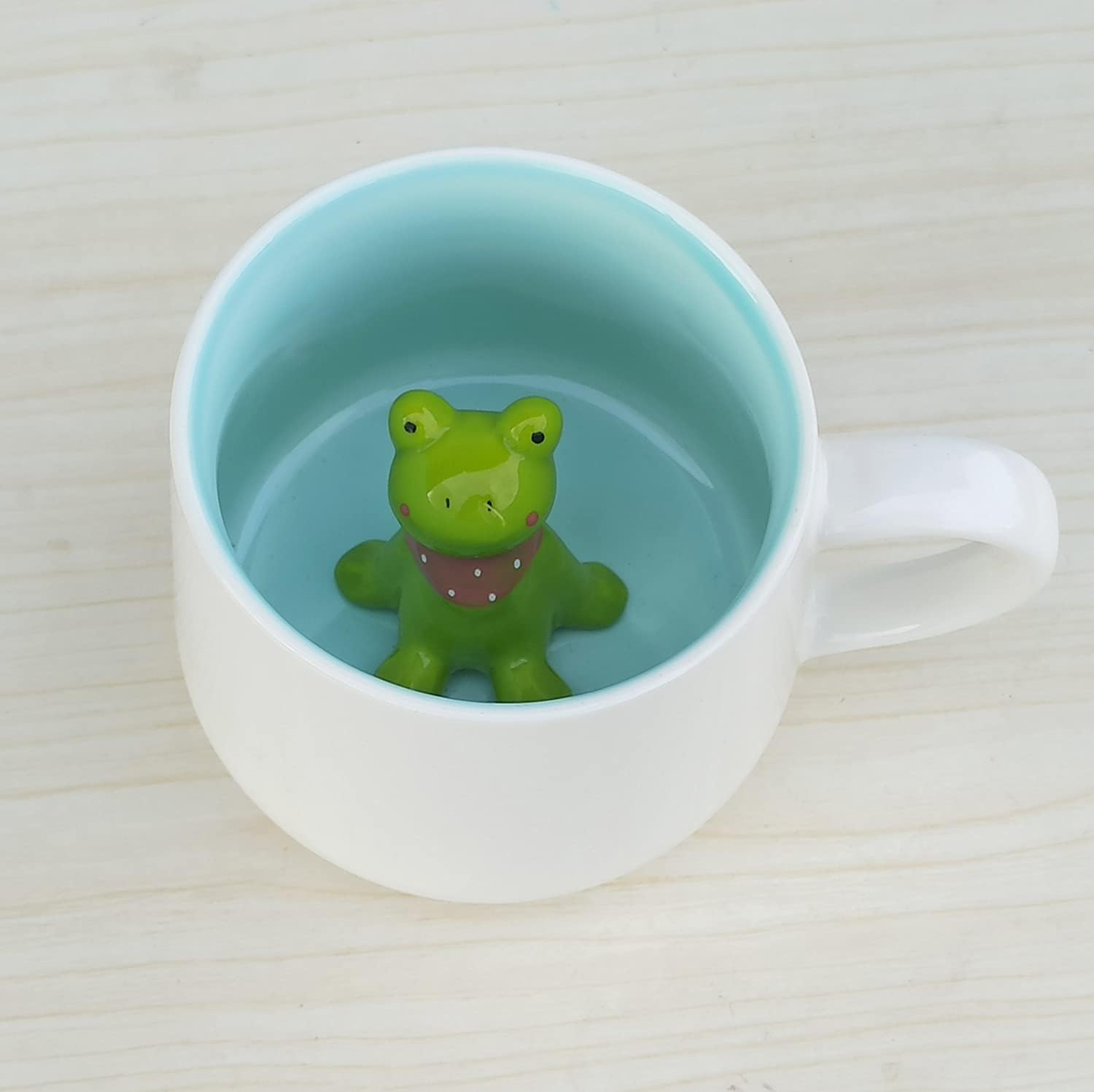 Coffee mug with a 3D frog surprise
